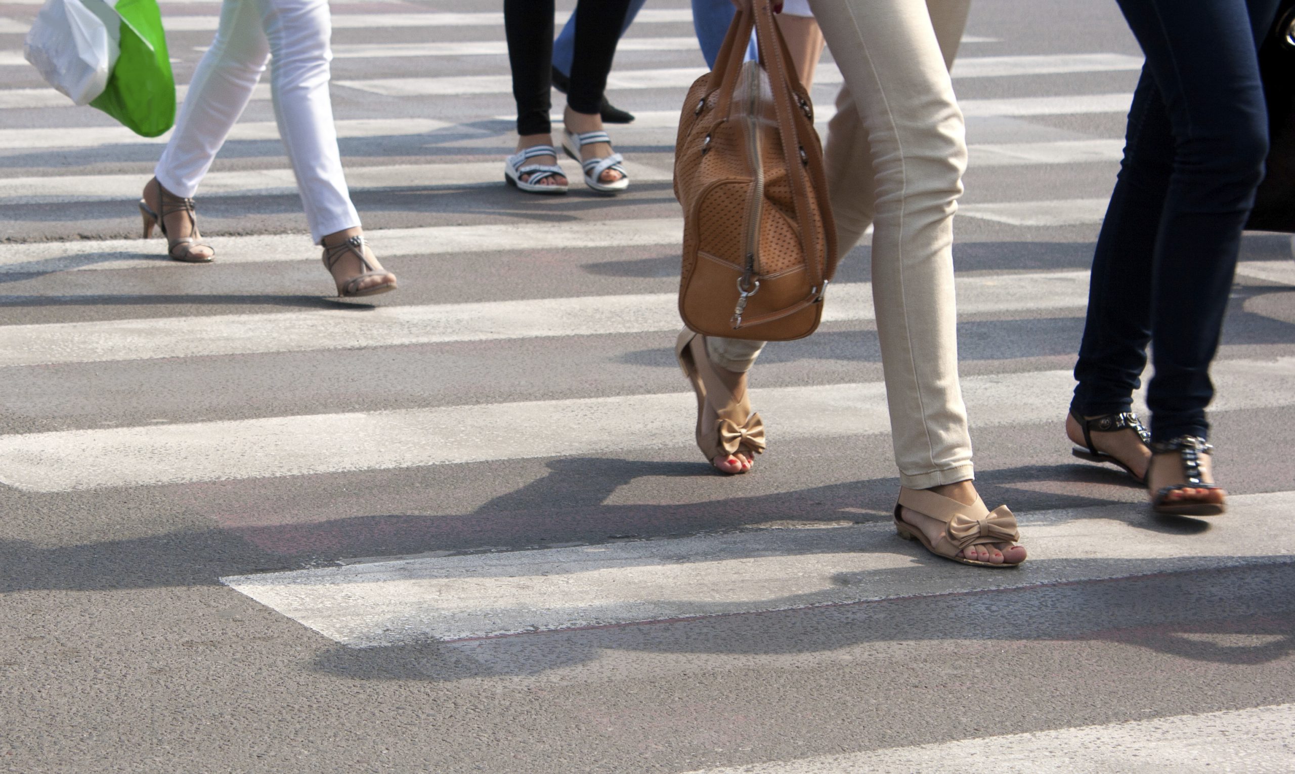 people crossing crosswalk