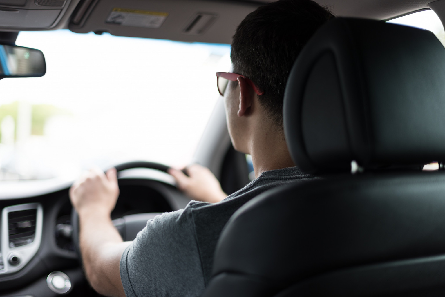 man driving a car