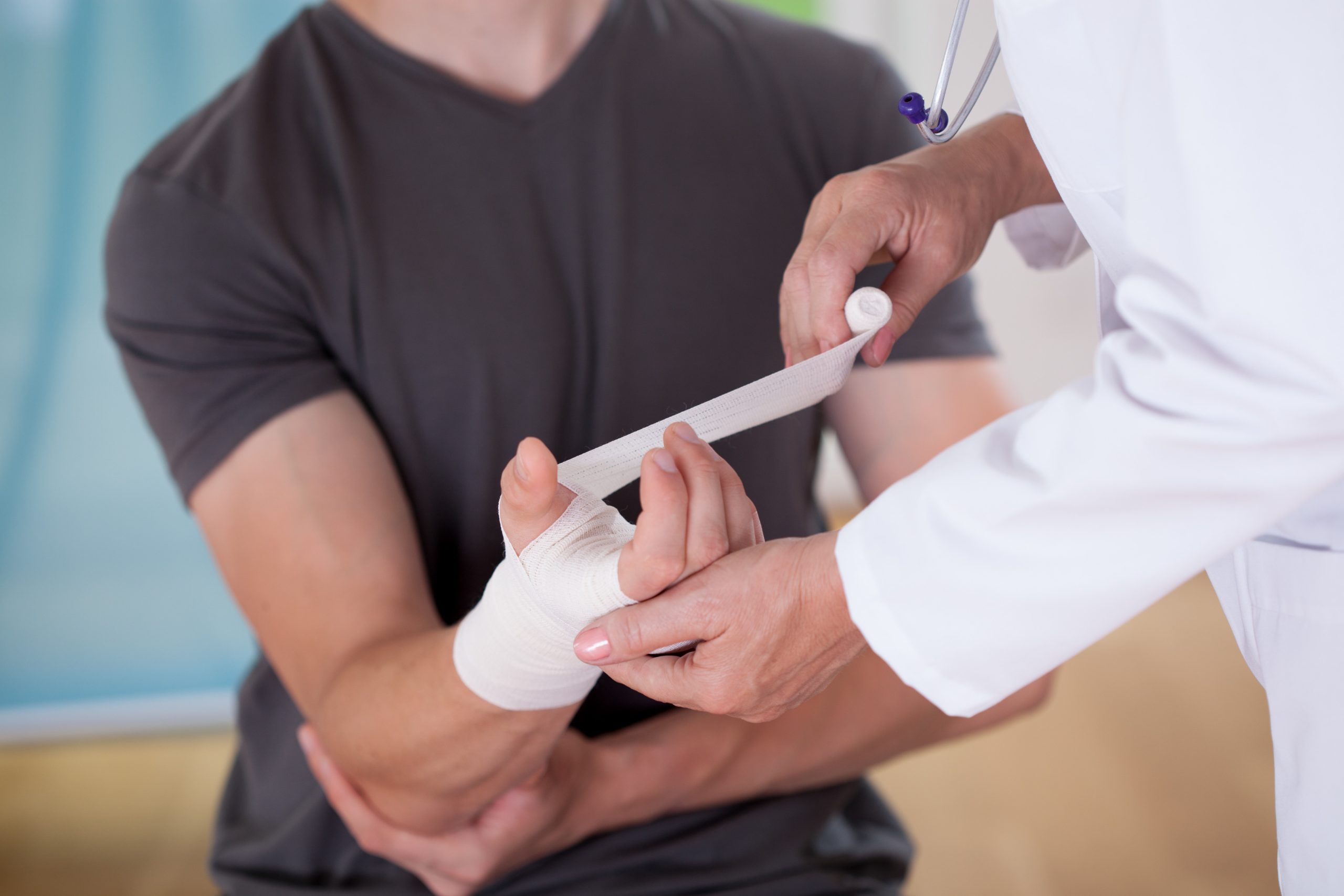 man getting bandaged by a doctor